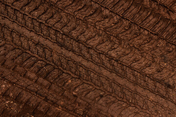 Tyre track on dirt sand or mud, Picture in retro or grunge tone. Car drive on sand. off road track....