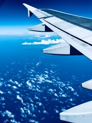 Aerial View of Blue Sky and Clouds from Airplane