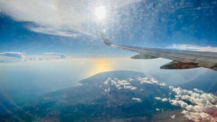 Aerial View of Blue Sky and Clouds from Airplane