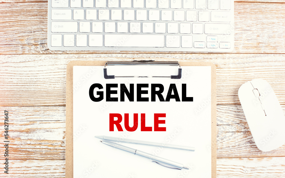 Poster general rule text on a clipboard with keyboard on wooden background