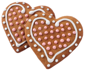 Two heart shaped decorated Christmas gingergreads isolated