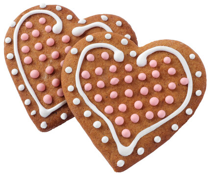 Two heart shaped decorated Christmas gingergreads isolated