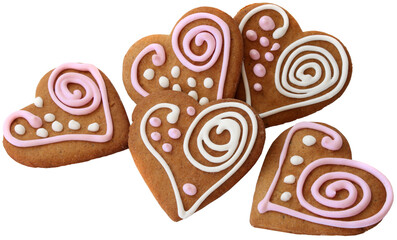 Five home made heart shape ginger breads decorated with pink and white sugar glazing isolated