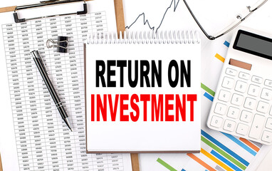 RETURN ON INVESTMENT text on notebook with chart, calculator and pen