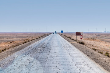 A view down the road crossing the desert east of Amman, Jordan in summertime