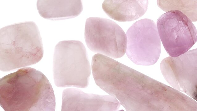 Morganite heap up jewel stones texture on white light isolated background. Moving right seamless loop backdrop.