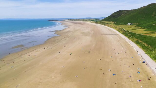 Aerial view of a huge wide sandy beach at low tide (Rhossili)