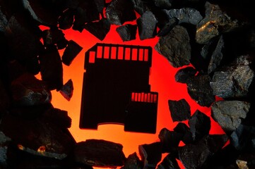 The micro sd card lies on hot coals. Close-up