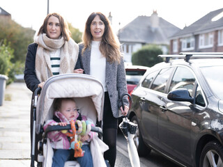 Women walking with baby in stroller