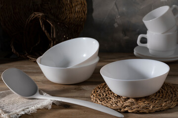 White ceramic tableware on a wooden table
