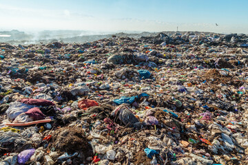 Burning trash piles in landfill