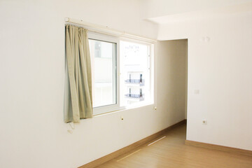 interior design of the apartment with white walls and brown floor