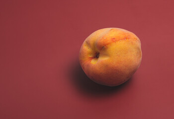 peach on a red background