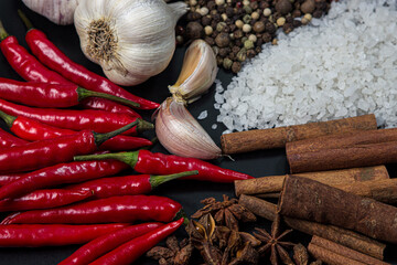 Various spices on a black background. Mix of different spices