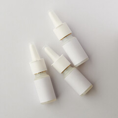 plastic nasal spray bottles mockup, medical moisturizer for flu and allergies, pharmaceutical...