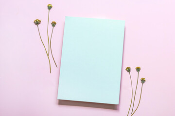 White blank card   with dry grass flower on pink background