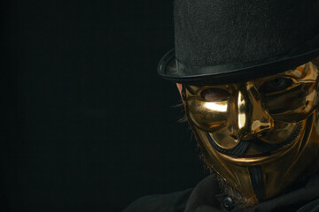 Fototapeta premium Scary figure with creepy mask and hat in the dark