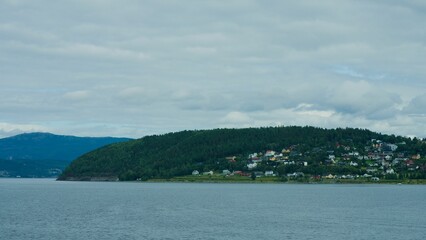 Fototapeta premium Beautiful view of a fjord town on a cliffside in Trondheim, Norway.
