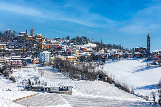 Small town on the hill covered in snow in Italy.