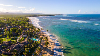 aerial drone shot of a beach on Punta Cana on a beautiful sunny day. the ocean with a crystal blue color that tourist love during vacation 