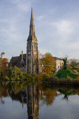 Fototapeta na wymiar reflection of St Alban's Church in the canal of the fortres