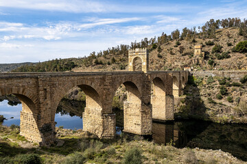 Fototapeta premium Roman bridge over the Tagus, Tajo river in Alcantara, Caceres province, Extremadura, Spain