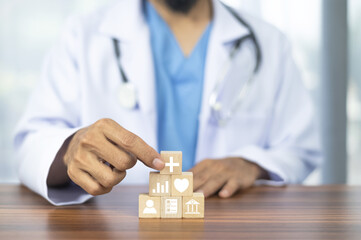 Doctor  hand arranging wood block stacking with icon healthcare medical, Insurance for your health...