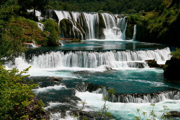 Beautiful river waterfall landscape nature in summer clear water and forest. 