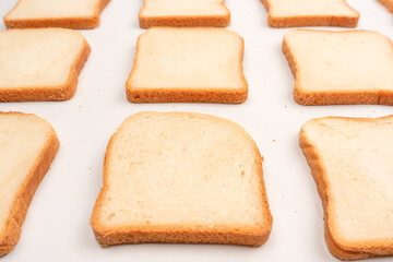 Delicious bread slices isolated on a white background, top view.