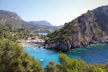View of the amazing bay with beautiful crystal clear water and cliffs in Paleokastritsa, Corfu,...