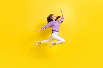 Fototapeta na wymiar Full length profile side photo of carefree crazy lady wear trendy violet sweater look hold empty space isolated on yellow color background