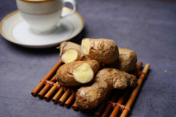 Top view of ginger tea on wooden background.