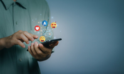 Male hand using smartphone for social media messaging or chatting via wifi technology, digital social media concept for relaxation during remote work from home