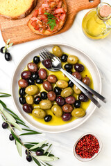 Mixed green olives and black olives with olive oil, healthy eating antioxidants	

