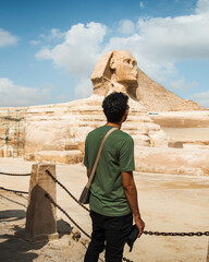 tourist in front of the sphinx in giza cairo egypt