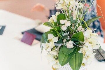Closeup shot of a bouquet of flower on a white table