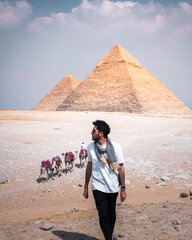 man in the pyramids of giza in egypt