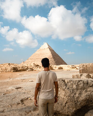 man in the pyramids of giza in egypt