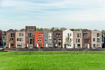 Zierikzee, The Netherlands, November 11, 2022: row  of ten houses with varying colors and details to suggest individuality