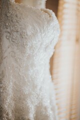 Closeup of a white beautiful wedding dress