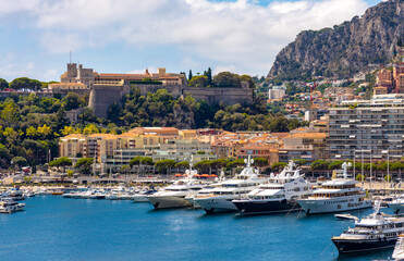 Fototapeta na wymiar Panoramic view of Hercules Port and yacht marina with Monaco Ville Rock quarter at French Riviera coast in Monte Carlo district of Monaco Principate