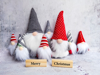 Wooden Cubes with Merry Christmas Text and Christmas Dwarfs  . Greeting Card with Christmas  Elf
