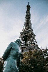 Fototapeta na wymiar Vertical shot of the Eiffel Tower in the daylight in Paris, France