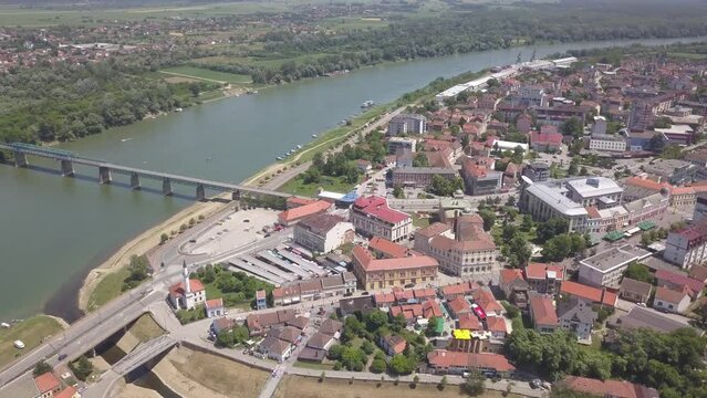 Aerial of a river in the Brcko district with a bridge connecting the lands, Bosnia and Herzegovina