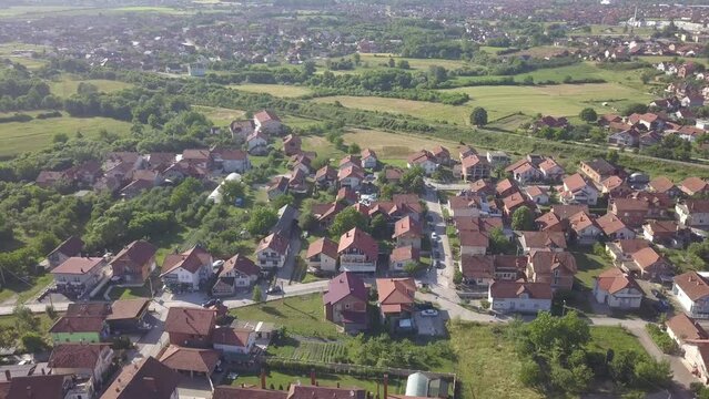 Aerial of the red-roofed houses surrounded by trees in Brcko district, Bosnia and Herzegovina