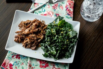 High angle shot of a Shredded Beef and Green Salad on wooden table