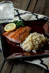 Vertical high angle shot of a salmon and rice meal