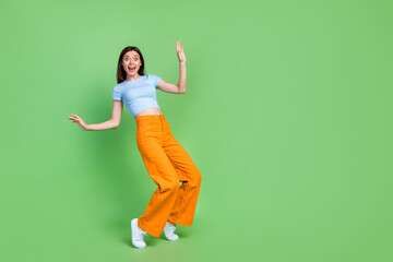 Full length portrait of positive pretty person stand tip toe impressed reaction empty space...