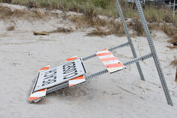Fallen beach closed hazrd sign