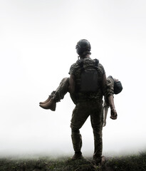 The commander carries a wounded soldier